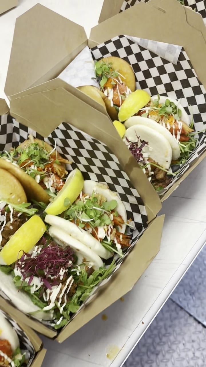 A kraft box of bao buns ready to hand over the counter