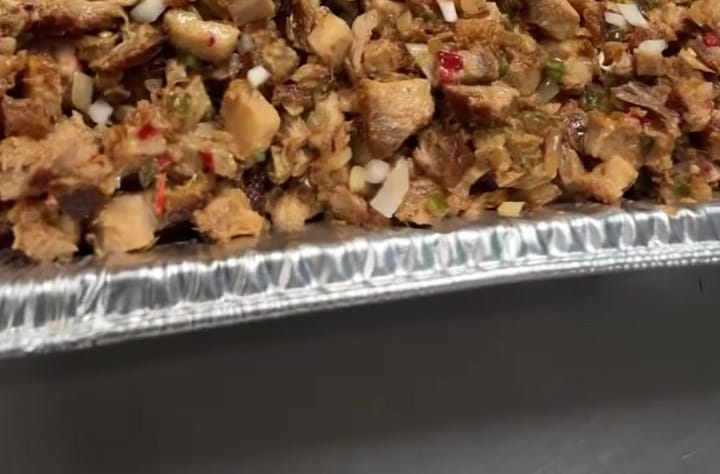 Close crop of glazed pork belly on the flat top